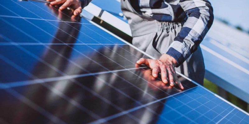 man-worker-firld-by-solar-panels