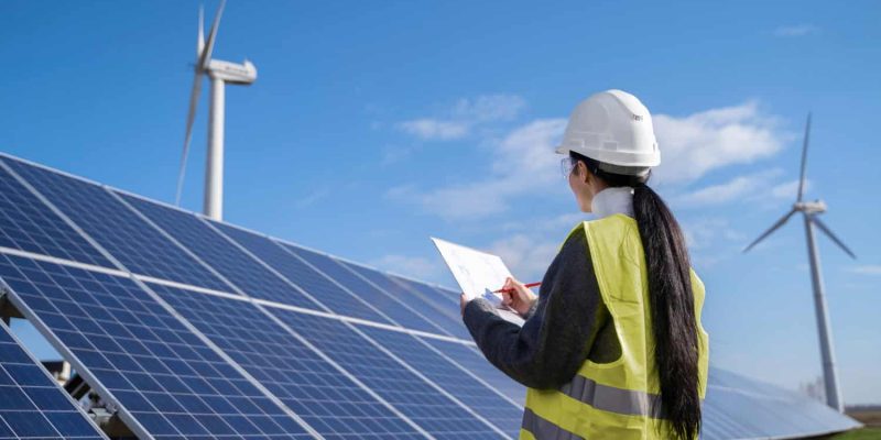 medium-shot-engineer-drawing-plan-outdoors